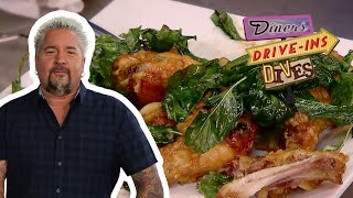 Guy Fieri Eats EXTRAGarlicky Spicy Thai Chicken Wings  Diners DriveIns and Dives  Food Network [upl. by Lyrahs585]