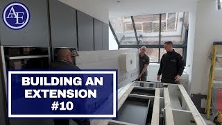 BUILDING AN EXTENSION 10  Tiling Worktops and Kitchen Bulkhead [upl. by Rebecka]