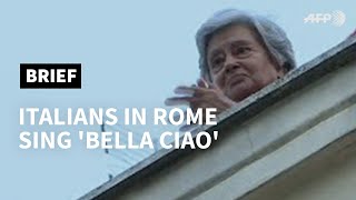 Italians in Rome sing Bella Ciao as virus lockdown continues  AFP [upl. by Adim982]