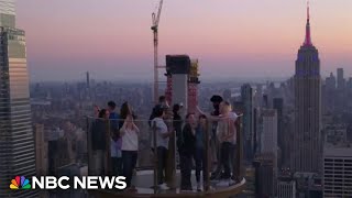 NBC News hosts ride Skylift an attraction that takes you above Rockefeller Center [upl. by Ij]