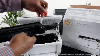 HP LaserJet Pro M28W All in One Wireless Printer loading the paper tray and Ink Tone clip removal [upl. by Giavani239]