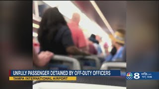 Tampa man calls passengers blueeyed white devils threatens to take down plane police [upl. by Ardnauq]