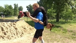 WifeCarrying Challenge Couples race in Ukraine’s wifecarrying competition [upl. by Tadeas897]