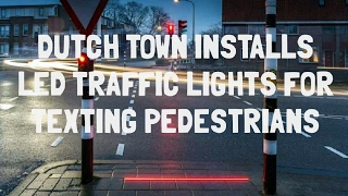 Dutch Town Installs LED Traffic Lights On The Ground For Texting Pedestrians [upl. by Yeoz]