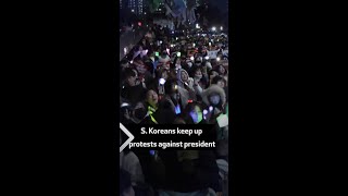 S Koreans keep up protests against president [upl. by Aigneis156]