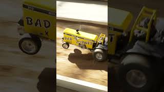 Yeah Baby Nitro burning chainsaw powered RC tractor pulling [upl. by Neyugn]