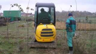 Excavator and the spade for the plants of trees [upl. by Toback]