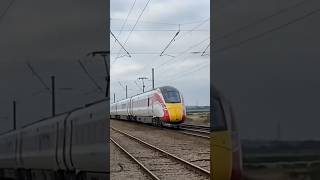 Train at BARNBY LEVEL CROSSING CLAYPOLE 11124 HarrogateKings cross AZUMA [upl. by Araccot]