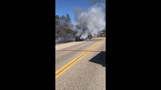 Car fire spreads to vegetation in California [upl. by Lenard]