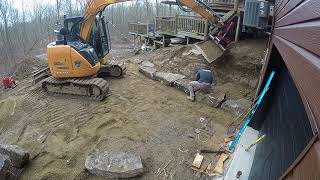 Case CX75 building stone retaining wall timelapse [upl. by Yorztif]