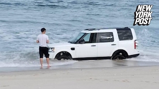 Beached SUV is nearly swept out to sea  New York Post [upl. by Raamal59]