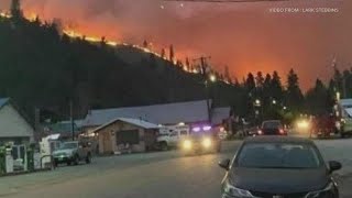 Firefighters work together to save small town in Okanogan County from wildfire [upl. by Ydniw]