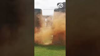 Climate activists spray Stonehenge with orange powder [upl. by Ardnaxila]