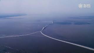 Spectacular tidal bores of Qiantang River in E China attract tourists to go watch [upl. by Bamby]