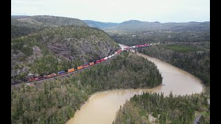 Across the bridge and along the lake AERIAL  CPKC train 10125 at Neys Ontario Canada [upl. by Gagliano]