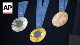 The Paris Olympics medals are monumental Theyre made with metal chunks from the Eiffel Tower [upl. by Tica]