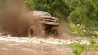 EPIC HUGE CHEVY 4X4 MUD TRUCK BLASTING THROUGH SLOUGH at Red River Mud Bog [upl. by Banyaz985]