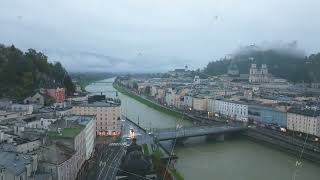 Tripod view from a unique point of Salzburg historic center with the Salzach River flowing through [upl. by Lleruj]