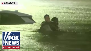 FOX Weather reporter rescues woman from car as floodwaters rise [upl. by Rennie627]