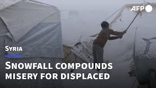 Syrias displaced struggle for food with heavy snowfall  AFP [upl. by Raeann349]