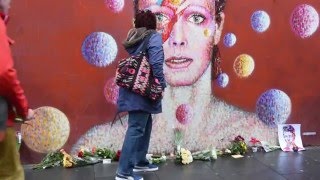 First David Bowie fans leave flowers at Brixton mural [upl. by Blau995]