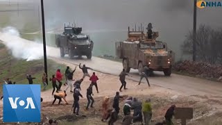 Civilians Throw Rocks at Turkish Military Convoy in Northwestern Syria [upl. by Rigby]