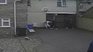 Horrific moment woman in dressing gown is punched as she tackles burglars [upl. by Ylrebnik]