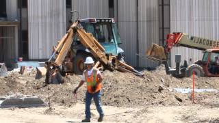 Case Backhoe getting set up to work and digging with back excavator arm [upl. by Ennaisoj]