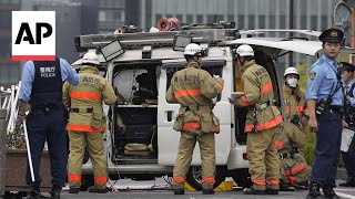 Man throws firebombs at Japans ruling partys HQ tries to drive into PM office [upl. by Gomer494]