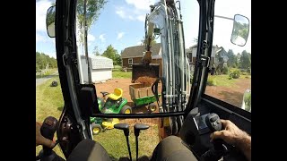 Topsoiling with an excavator and loading little trailers Takeuchi TB260 [upl. by Ennayr359]