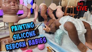 Working on reborn silicone dolls painting layers of silicone paint [upl. by Westley]