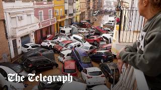 Spain flash floods Dozens dead as cars pile up in Valencia [upl. by Ewer420]