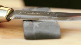 Marttiini Academy How to sharpen a knife with a sharpening stone [upl. by Auop215]