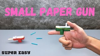 Diy mini paper gun  Make a Paper finger gun  Origami simple paper gun [upl. by Kedezihclem195]