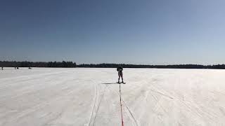 Guy Skis On Icy Surface And Water While Being Pulled By Snowmobile  11879553 [upl. by Hagai]