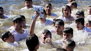 Epiphany celebration 57 dove into the water to retrieve the cross [upl. by Yuhas]