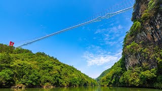 Worlds longest glassbottomed bridge opens in China [upl. by Airetnuhs]