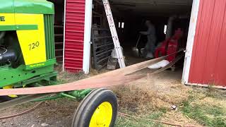 John Deere 720 running a belt driven hammer mill [upl. by Aissyla567]