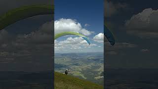 Paragliding Amidst Majestic Mountains and Billowing Clouds [upl. by Itaws]