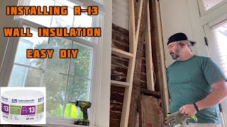 How to install r13 wall insulation easy diy [upl. by Enileda347]