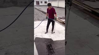 The process of painting a concrete surface with bitumen paint under high pressure [upl. by Crowe]