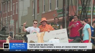 Top eater chows down 14 hot dogs to win Cross Street Market contest [upl. by Tavie]