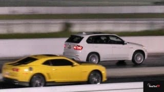 BMW X5M vs Camaro SS  14 mile Drag Test Video  Road Test TV ® [upl. by Earlie]