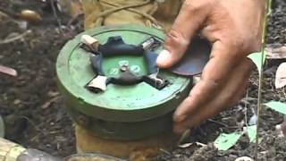 Cambodian shows how to disarm a mine [upl. by Htieh]