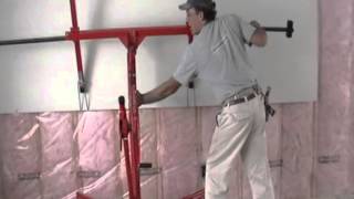 Installing drywall on upper walls with lift by Laurier Desormeaux [upl. by Aamsa]