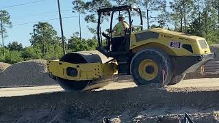 A Bomag roller compacting for a new sidewalk [upl. by Glorianna]