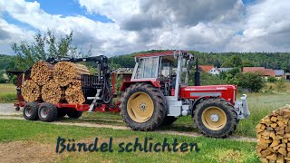 Holzbündel stapeln mit Rückewagen und Schlüter [upl. by Ynobe]