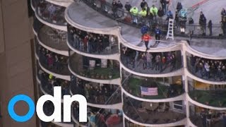 Tightrope artist Nik Wallenda walks blindfolded between Chicago skyscrapers [upl. by Nirroc]