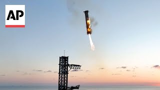 WATCH SpaceX catches Starship rocket booster back at the launch pad [upl. by Arahsal]