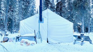 Winter camping overnight in a canvas tent with a wood stove [upl. by Neiluj]